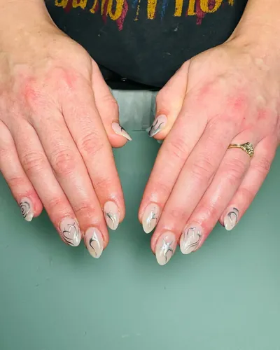 Soft pink ombre nails with delicate floral art